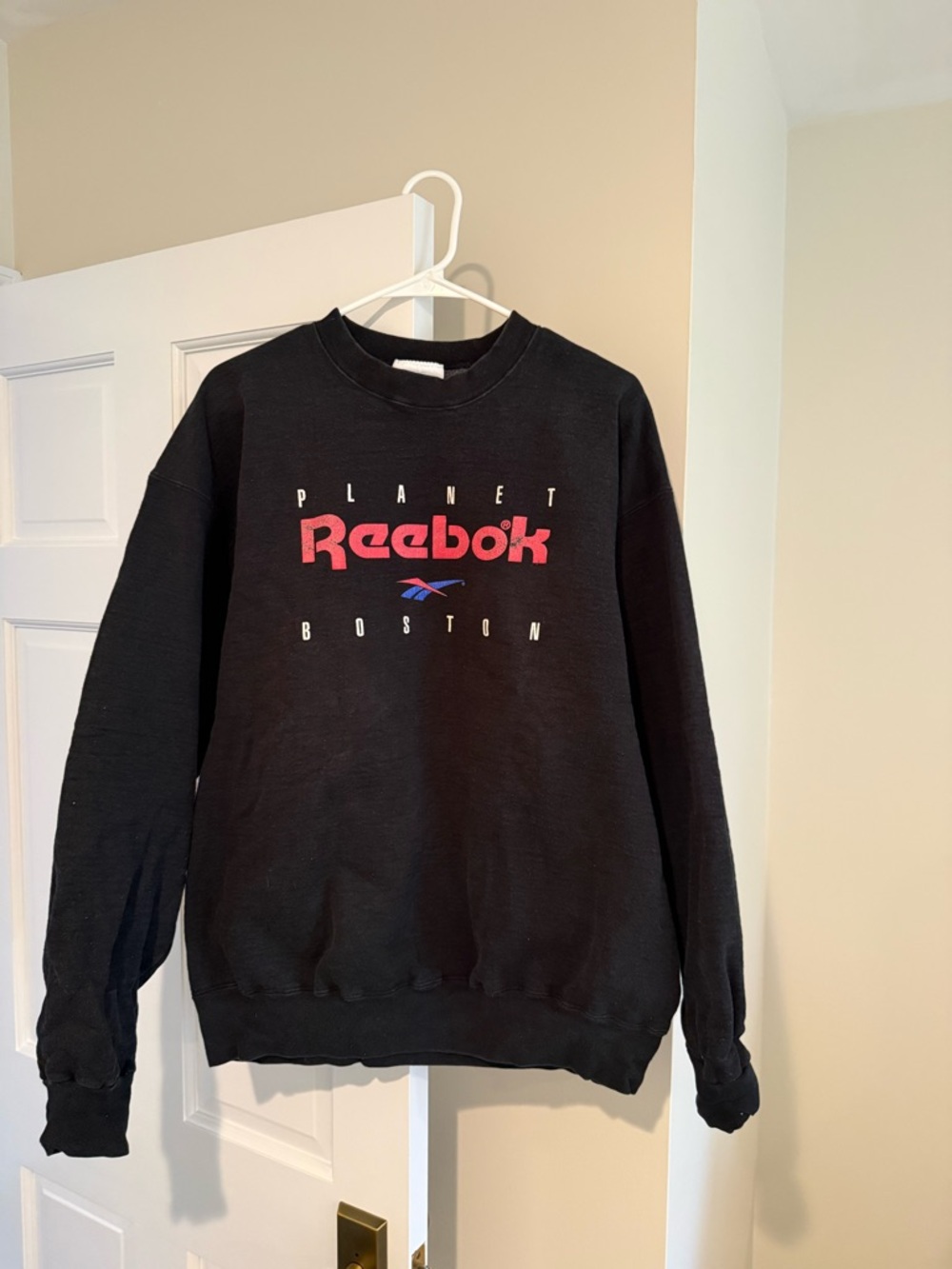 Reebok Black Crewneck Sweatshirt with Red Logo and Blue Accent